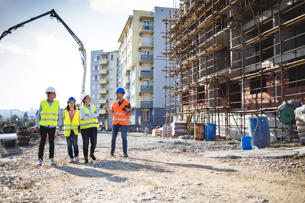 Group of construction workers on building site.Stock photo